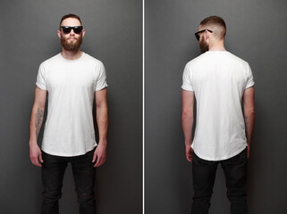 Hipster handsome male model with beard wearing white blank t-shirt with space for your logo or...