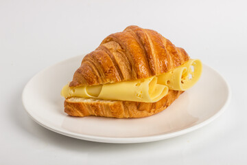 Croissant with cheese on a neutral background selective focus