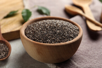 Chia seeds in bowl on table, closeup