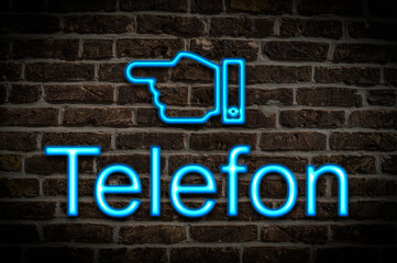 Fototapeta premium Leuchtreklame Telefon
