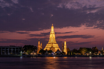 Fototapeta na wymiar Wat Arun Temple beside Chao Phraya River at twilight time in Bangkok, Thailand. One of the most famous place of Thailand's landmarks.