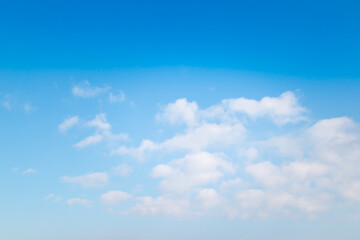 White fluffy cloud on blue sky background.