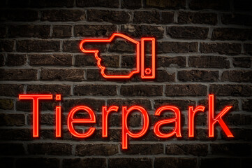 Fototapeta premium Leuchtreklame Tierpark