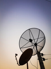 A satellite dishes at evening time