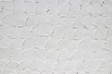 White concrete wall with plaster pattern