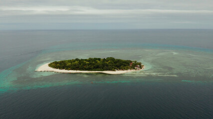 Beautiful beach on tropical island surrounded by coral reef, top view. Mantigue island. Small island with sandy beach. Summer and travel vacation concept, Camiguin, Philippines, Mindanao