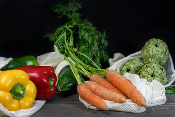 Fresh vegetables in eco reusable shopping bag .Zero waste ,plastic free concept .Groceries in eco friendly cotton bags,sustainable lifestyle .