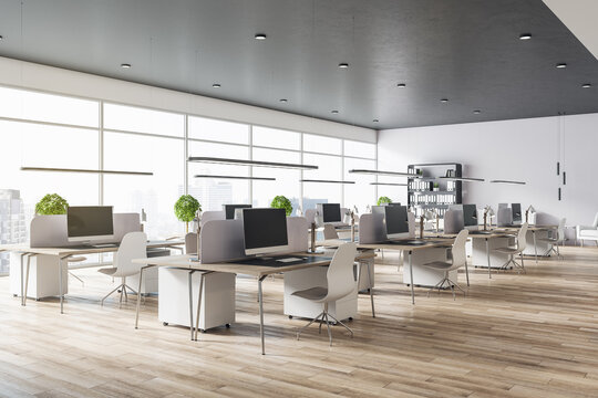 Modern eco spacious office with wooden floor and tables, big windows, grey top and white chairs