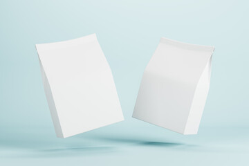 Two white paper bags with copyspace for your logo levitating in the air at blue background. Mock up