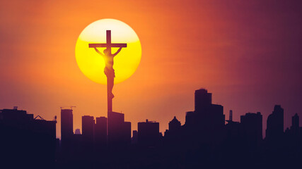 Christian cross with silhouette of skyscrapers