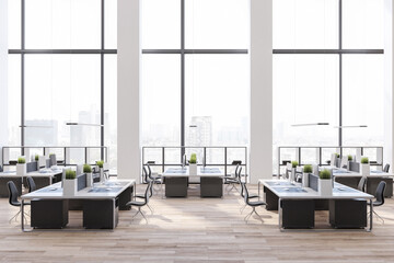 Great city view from modern office with high ceiling, minimalistic style furniture, comfortable workplaces and wooden floor