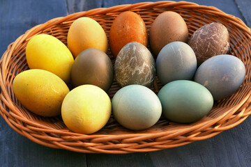 Easter eggs collection in the basket. Natural dyed Easter eggs.