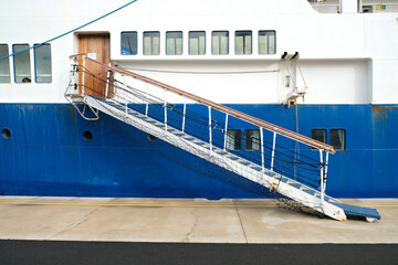 Gangway entrance on a ship docked in harbor.