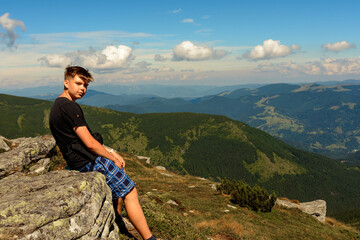 Naklejka premium Tourists and mountains of the Montenegrin ridge, endless landscapes and the silence of the mountains.