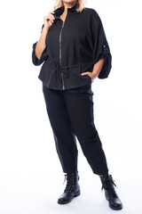 Plus size woman in a casual clothes on a white background.