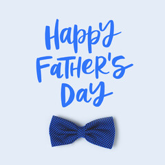 Happy Fathers Day. Festive concept with bow tie on a blue pastel background.