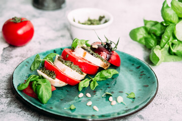 Caprese salad. Tomatoes, mozzarella, basil, pesto, balsamic sauce