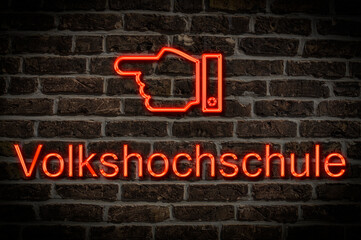 Fototapeta premium Leuchtreklame Volkshochsschule