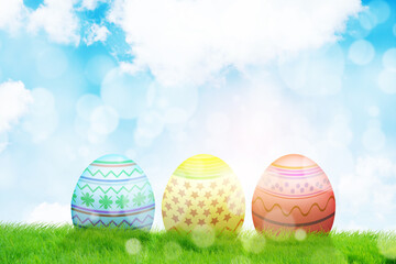 Five colorful easter eggs with blue sky background