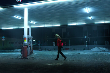 Lonely girl at the gas station