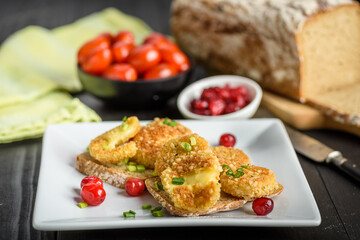 sandwich with fried camembert cheese and bacon