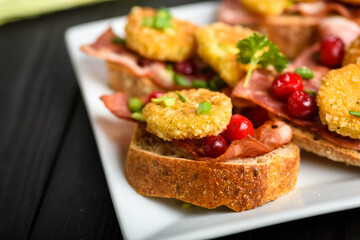 sandwich with fried camembert cheese and bacon