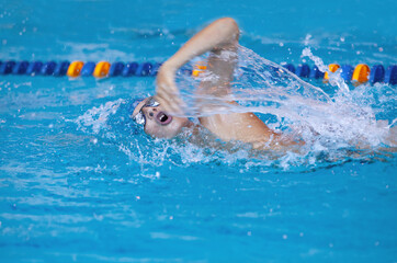 sporty swimming in pool