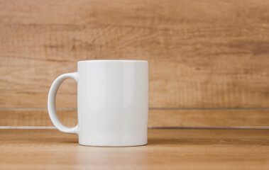 White mug on the wooden table