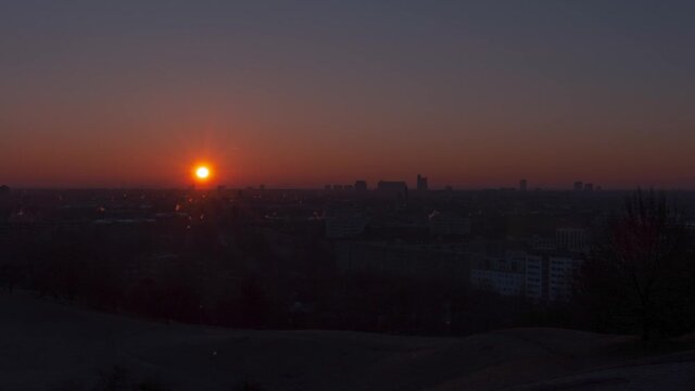 Time lapse during sunrise over the bavarian capital city Munich in Germany on clear day without clouds