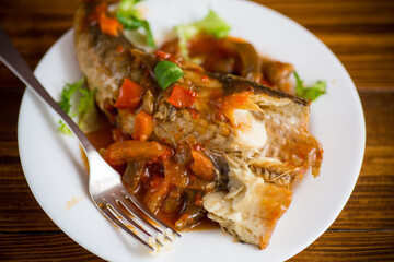 whole fish hake stewed with carrots, beets, peppers and other