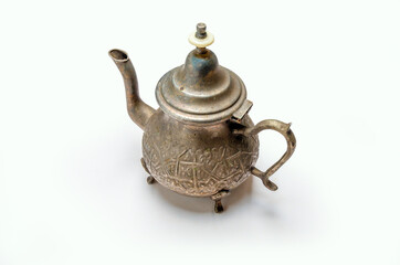 antique brass teapot on white background