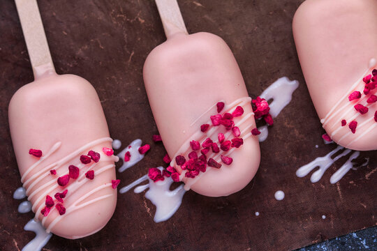 Cake Popsicles. Raspberry White Chocolate Ice Cream Pops. Homemade Cakesicles. 