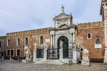 Fototapeta premium Fragments of the historic Venetian Arsenal (Arsenale di Venezia) complex. Construction of Arsenal began in 1104, during Venice republican era. Venice, Italy.