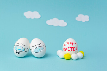 Easter bunnies do-it-yourself masked eggs to decorate the Easter holidays advertising discount promotion on a blue background illuminating coronavirus idea creative