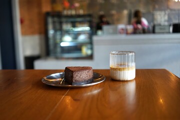 Dirty coffee with cake in a coffee shop