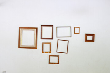 empty picture frames on white wall