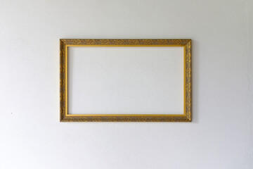 empty picture frames on white wall