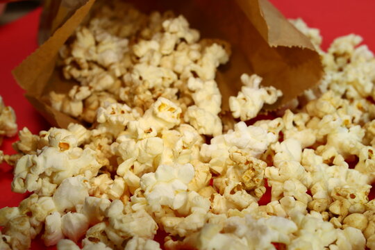 Caramel Popcorn Spilling Out Of A Paper Bag