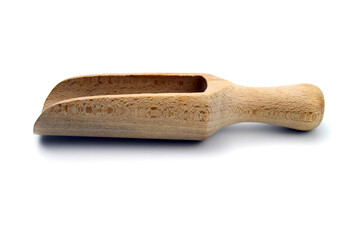 Small wooden scoop for spices isolated on white background