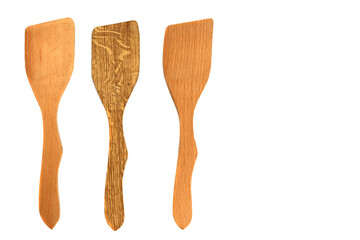 Wooden kitchen spatulas isolated on white background