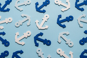 Blue anchors on a blue background.