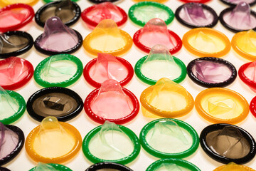 Colorful condoms background.