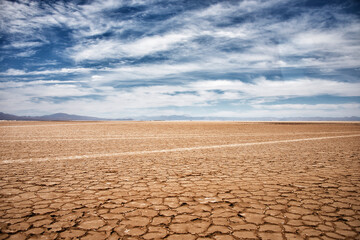 Salt flats under a beautiful sky with mountains in the distance, Salinas Grandes, Argentina
