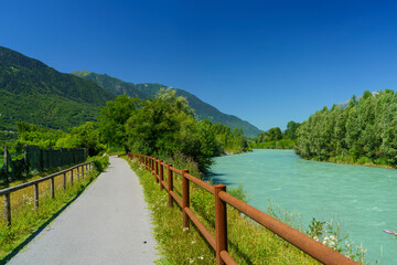 Fototapeta na wymiar The Adda river along the Sentiero della Valtellina at summer