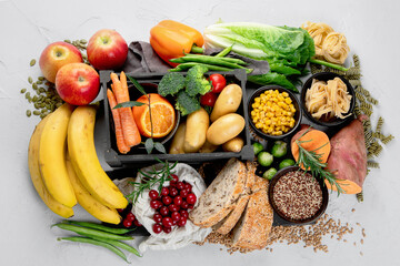 Best sources of carbs on light gray background. Healthy food concept.