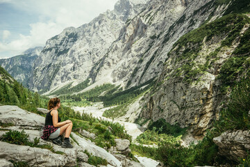 Girl hiking in the european mountains