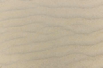 Natural sand stone texture background. sand on the beach as background. Wavy sand background for summer designs.