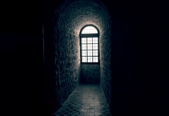 Sunlight shines through a window in an old castle