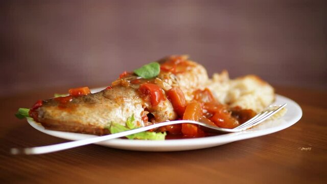 whole fish hake stewed with carrots, beets, peppers and other