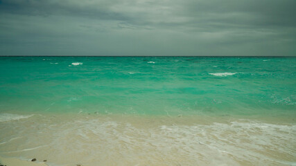 Obraz premium Sandy tropical beach and blue sea. Summer and travel vacation concept.